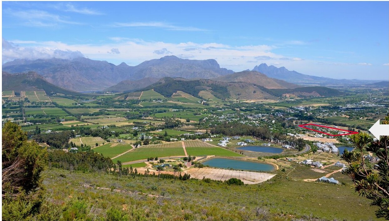 Aerial view of Franschhoek with the WeGroYou campus footprint outlined in red against the valley
